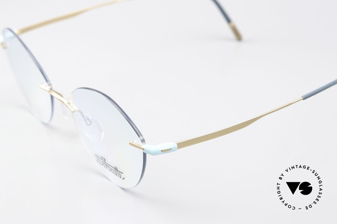 Silhouette 5516 Matt Gold Turquoise Titan, here with very feminine demo lenses; cat's eye style, Made for Women